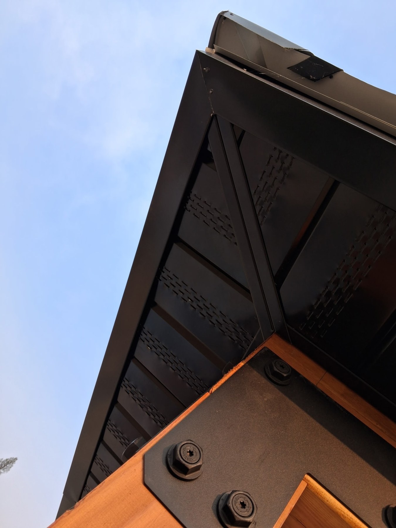 Black steel truss & vented soffit — Roofing project by KD's Custom Exteriors